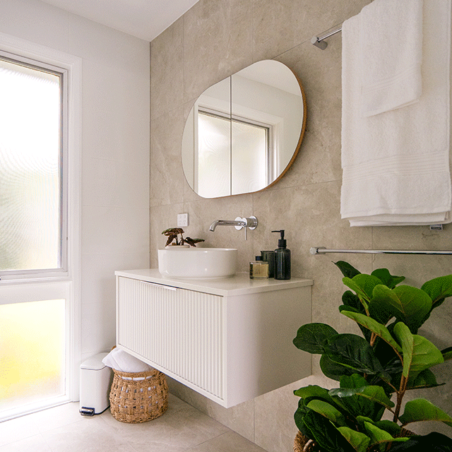 glenorie ensuite reveal x the blue space - tilly tundra ivory tile, marquis white fluted cove vanity, caroma chrome taps, Ingrain horizontal pill shaving cabinet